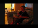 Justin Bieber playing the djembe